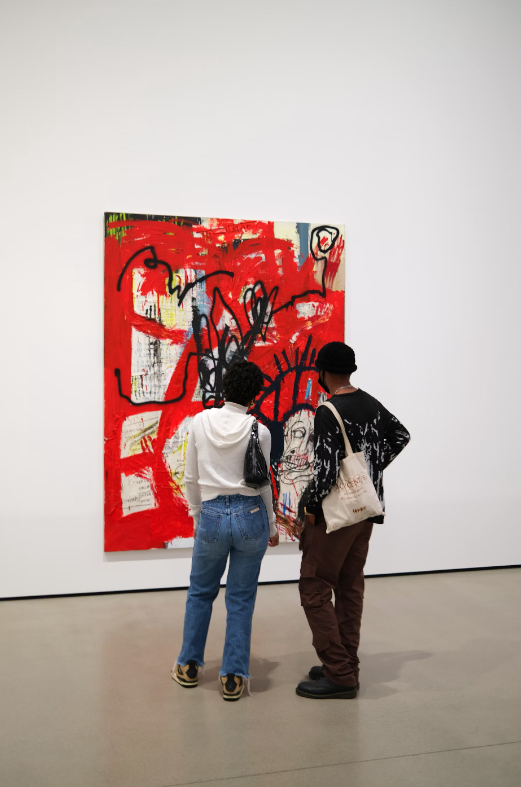 couple at art gallery looking at artwork